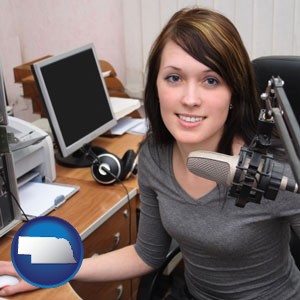 a female radio announcer - with Nebraska icon