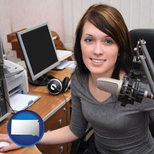 a female radio announcer - with South Dakota icon